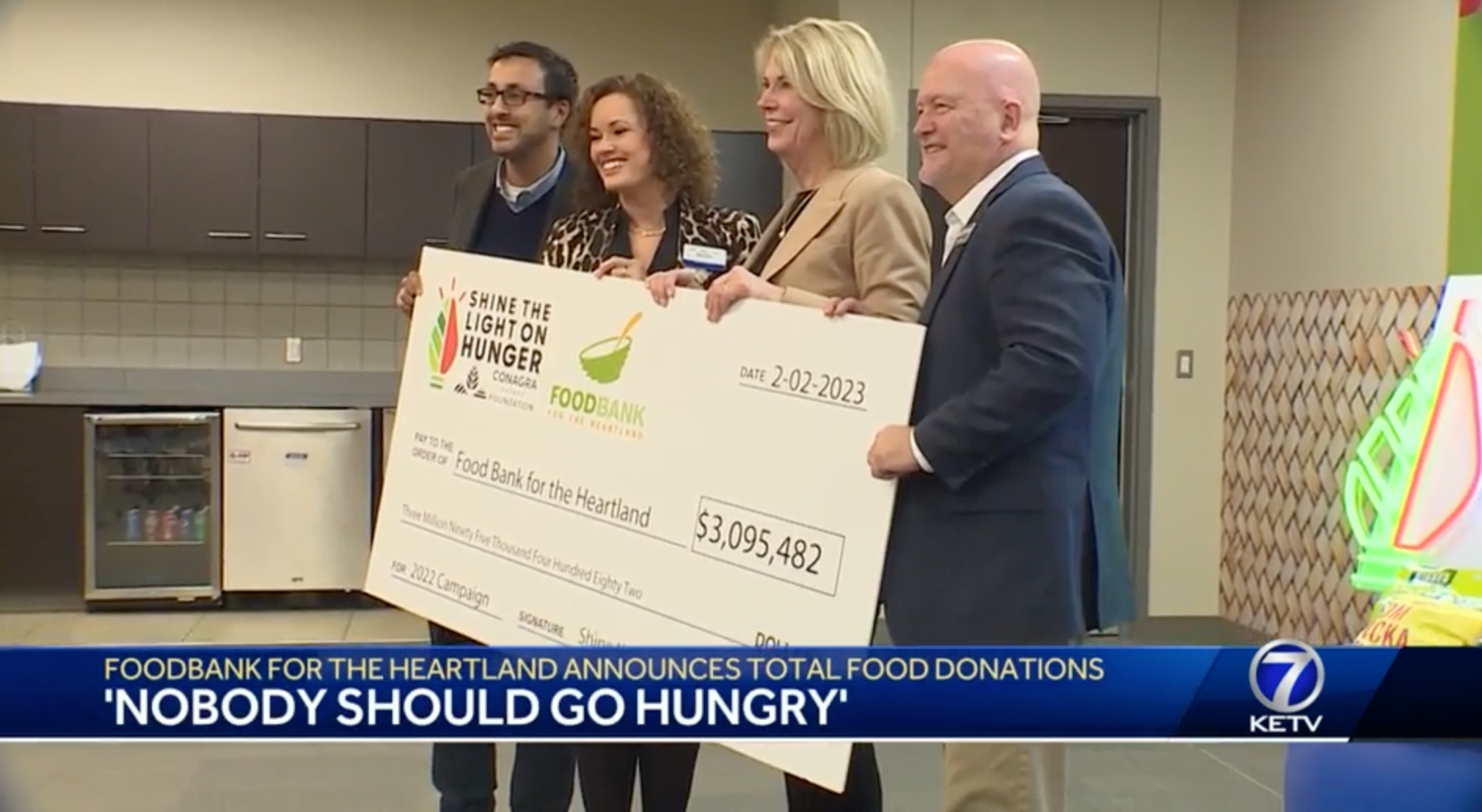 Photo from KETV of Conagra Brands and Baker's representatives, Mayor Stothert, and Brian Barks