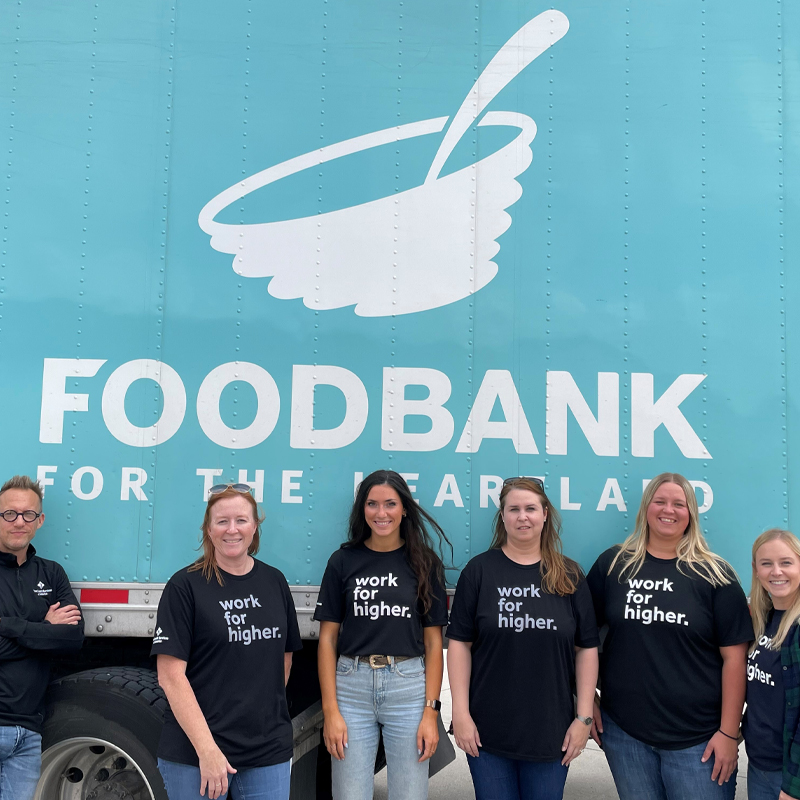 40 Faces of 40 Years Farm Credit Services of America Photo of FCSA group standing in front of a Food Bank trailer