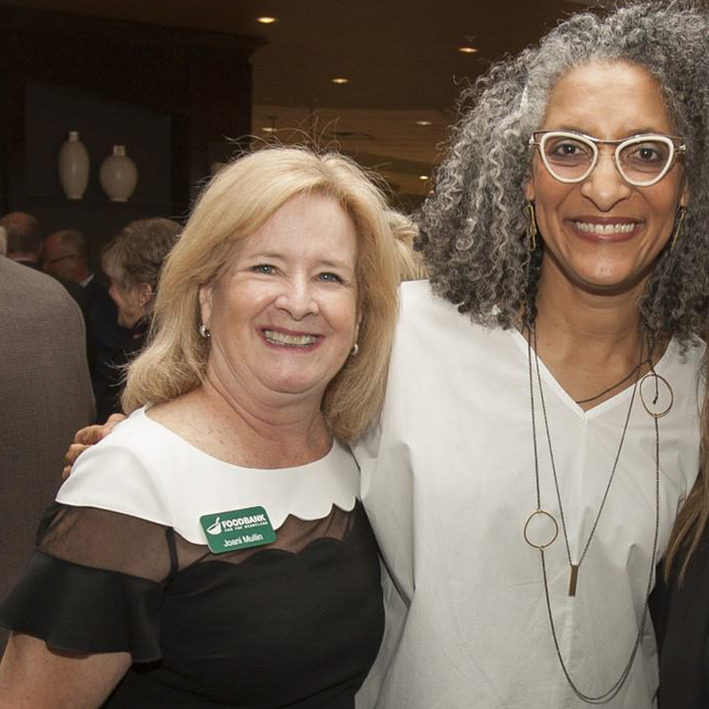 40 Faces of 40 Years Joani Mullin standing with Celebrity Chef Carla Hall