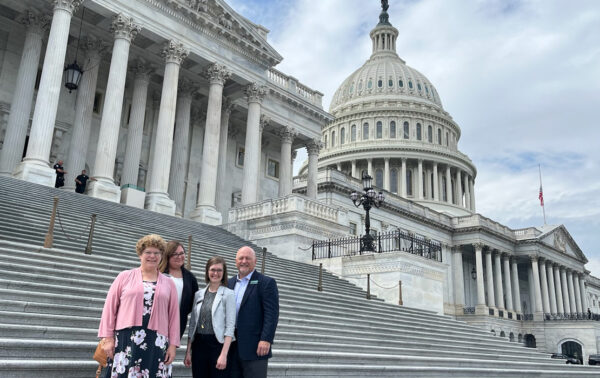 Photo of FBFH Nebraska SNAP Manager, Cindy Doerr, Food Bank of Lincoln Network Capacity Manager, Katie Nungesser, Communications Director, Amanda Fahrer, and FBFH President & CEO, Brian Barks in front of the U.S. Capitol