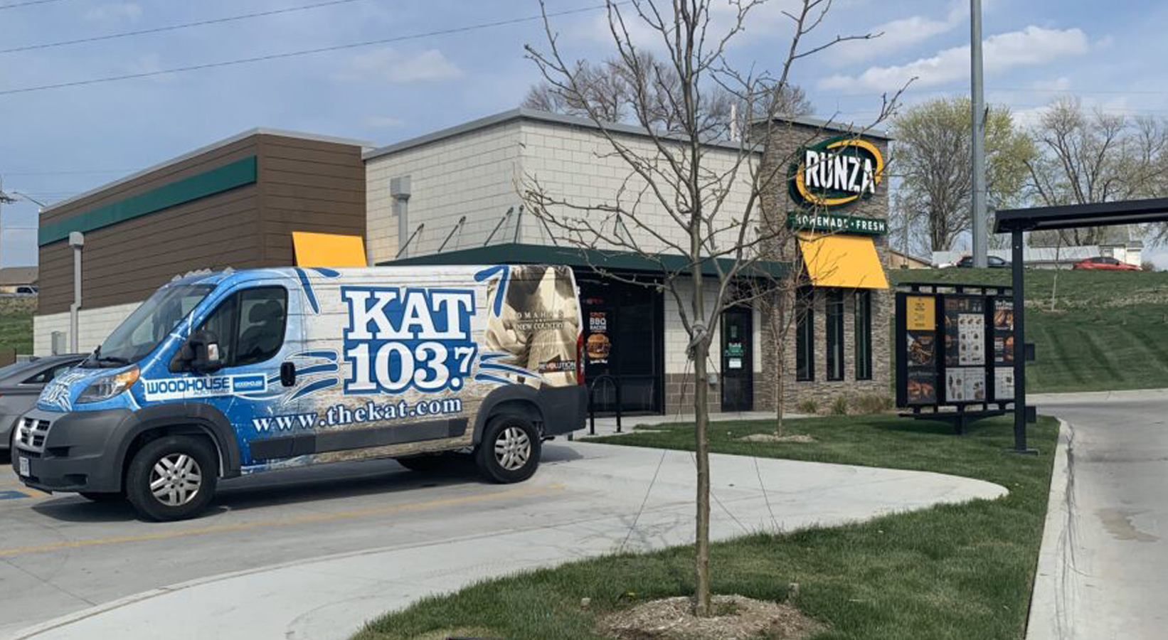 Photo of Runza Restaurant location and KAT 103.7 van outside during Feeds the Need