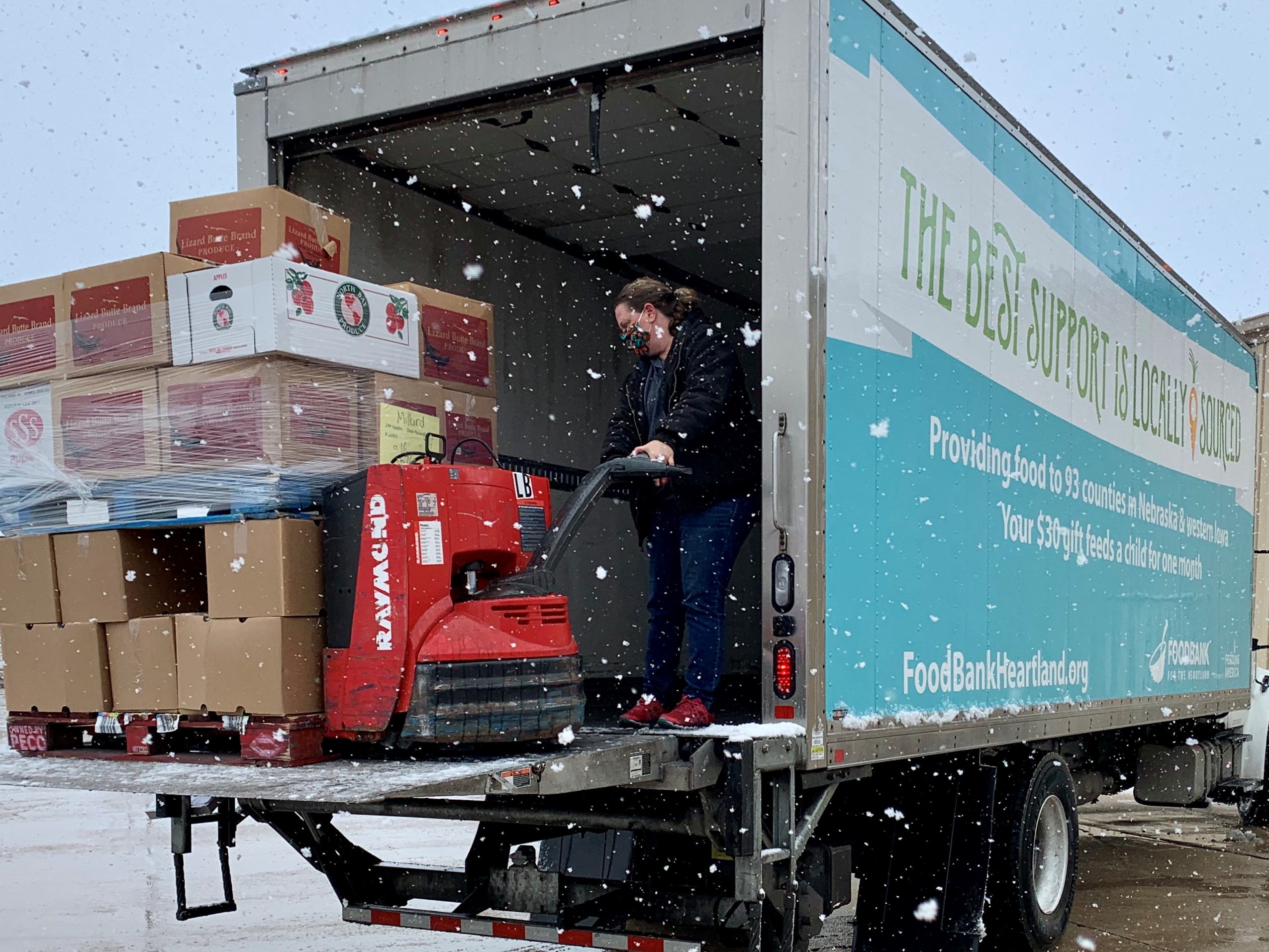 Photo of Food Bank for the Heartland truck and distribution in the snow