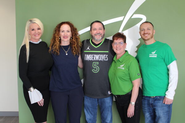 Executive team members with Doug