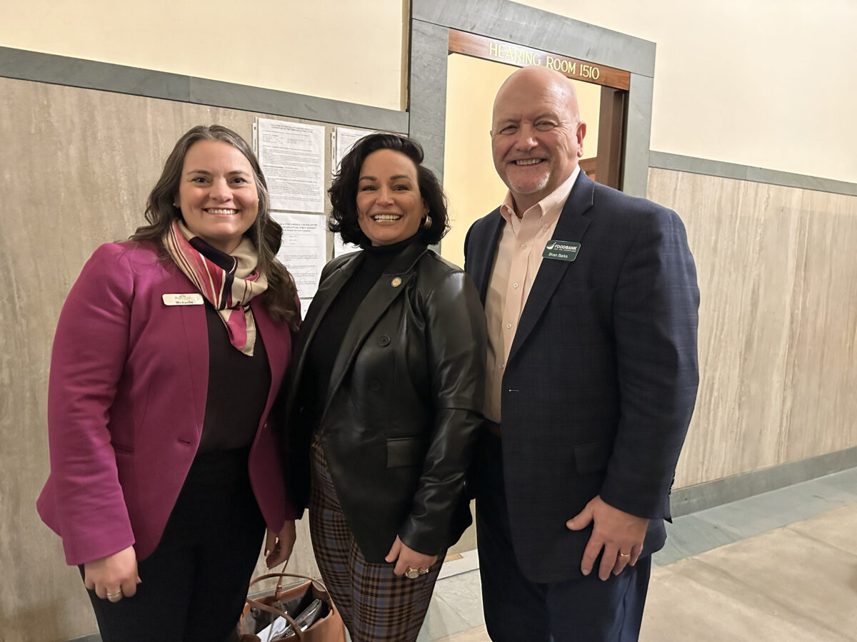 Representatives from Food Bank of Lincoln and Food Bank for the Heartland pose with Senator Jen Day (middle) in support of LB952, which would require the Department of Health and Human Services to implement the federal Summer Electronic Benefits Transfer (EBT) Program.